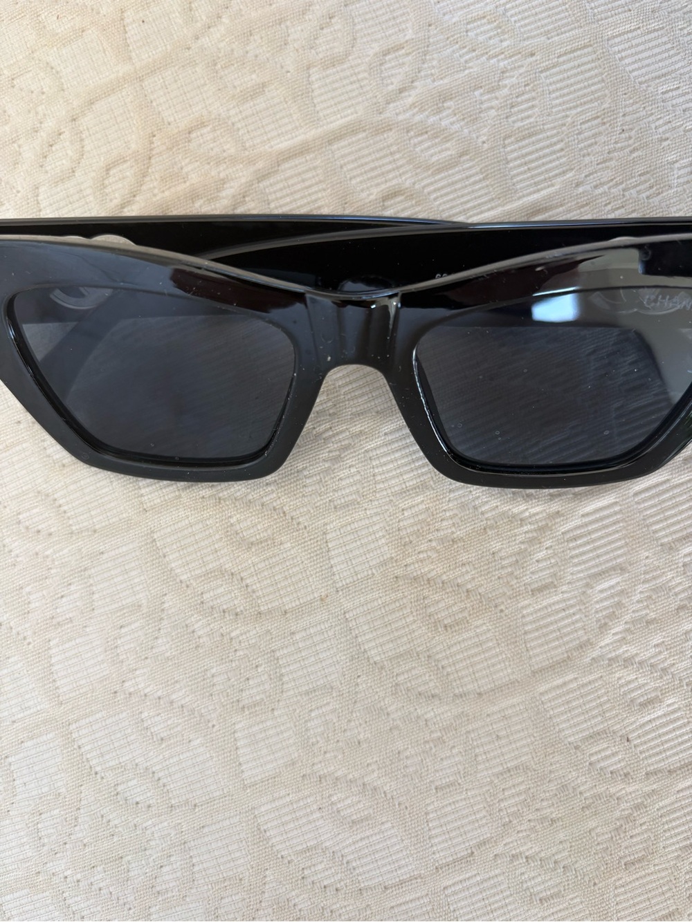 Sunglasses with leather case and Black Box.